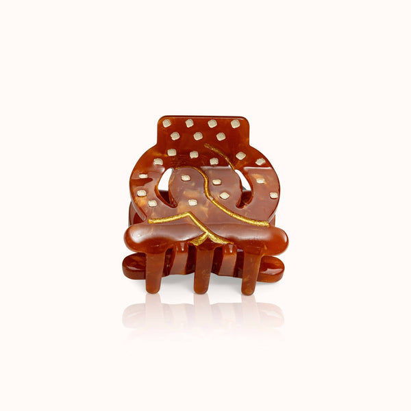 Piccola molletta per capelli a forma di pretzel