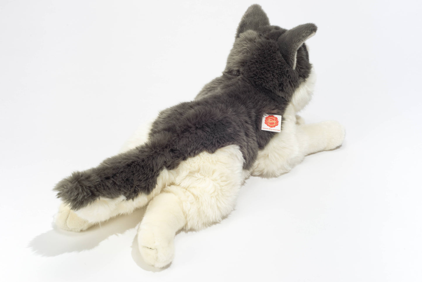 Gran husky de peluche acostado
