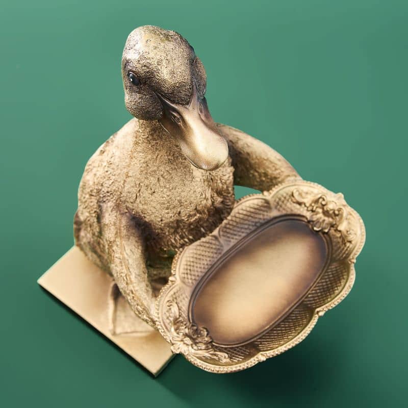 Tarjetero de resina con forma de pato dorado