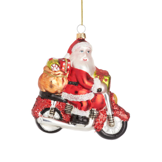 Santa Claus shaped ball on a motorcycle