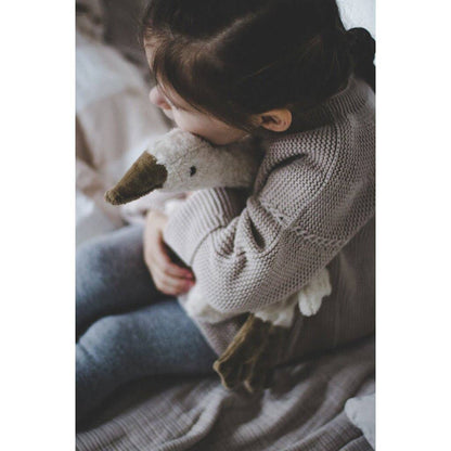 Small hot water bottle in the shape of a cuddly white goose