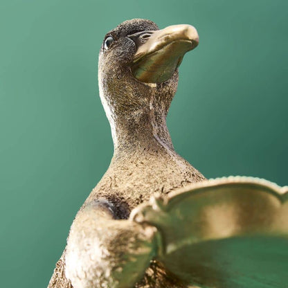 Tarjetero de resina con forma de pato dorado