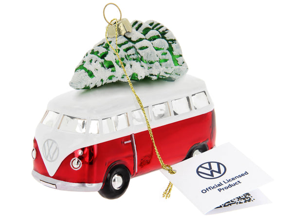 Decoração de Natal com uma VW T1 Kombi vermelha e branca e árvore de Natal.