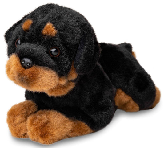 Rottweiler de peluche acostado