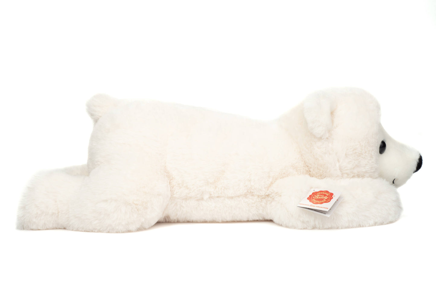 Oso polar de peluche acostado