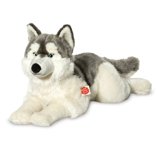 Gran husky de peluche acostado