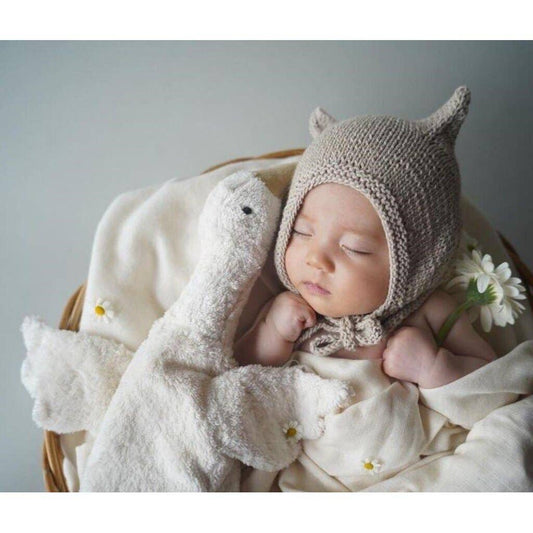 Petite bouillotte en forme d'oie blanche câline