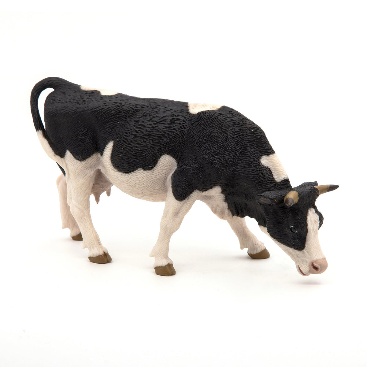 Figurine Vache noire et blanche broutant