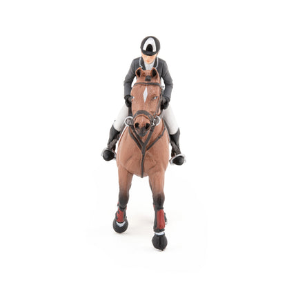 Show jumping horse and rider figurine