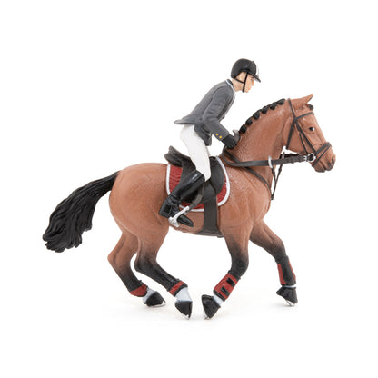 Show jumping horse and rider figurine