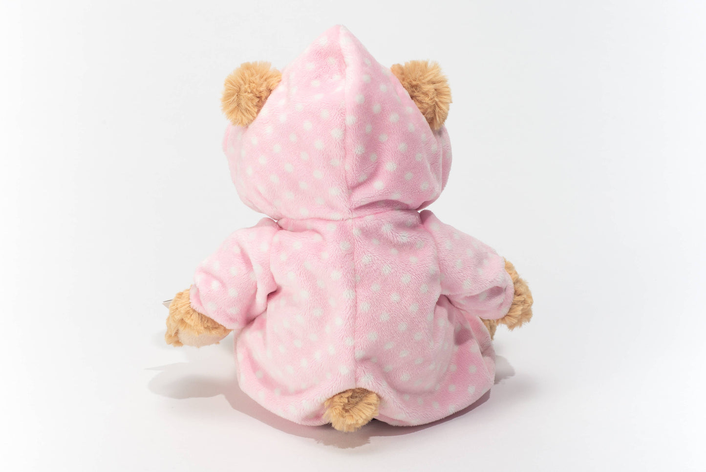 Osito de peluche en pijama rosa