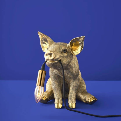 Lampada da tavolo a forma di maiale dorato