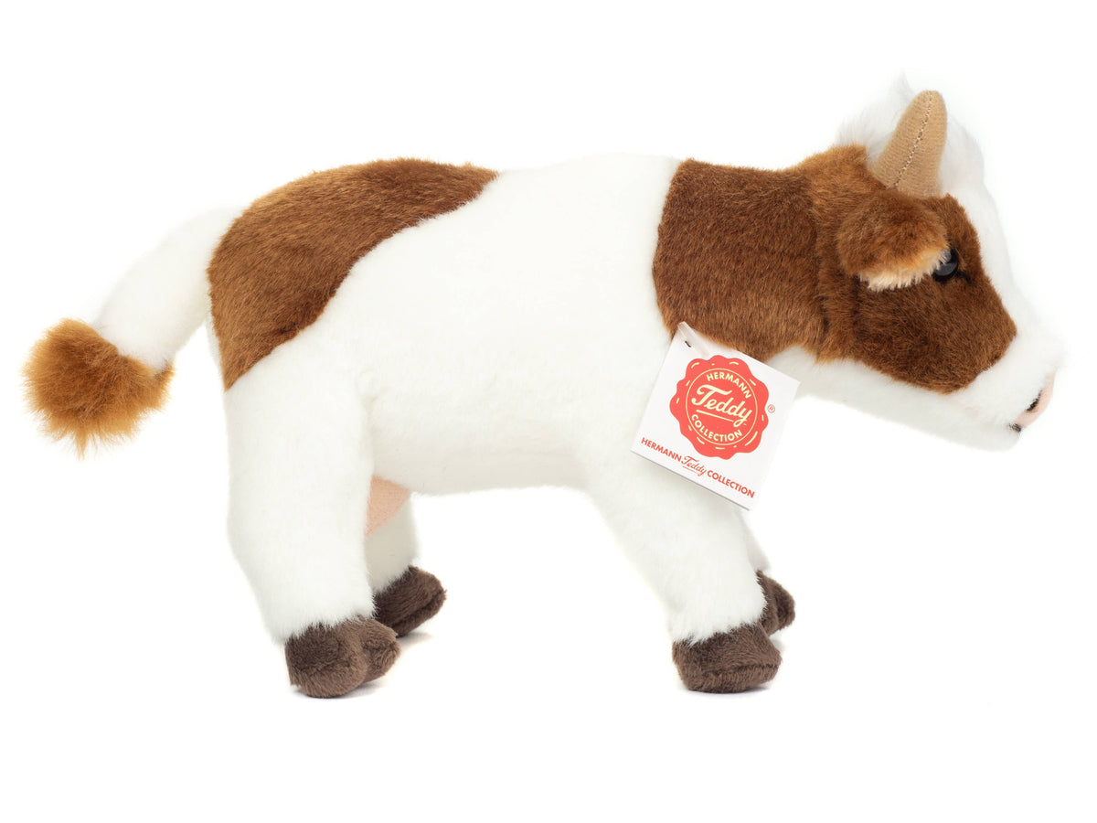 Peluche a forma di mucca marrone e bianca
