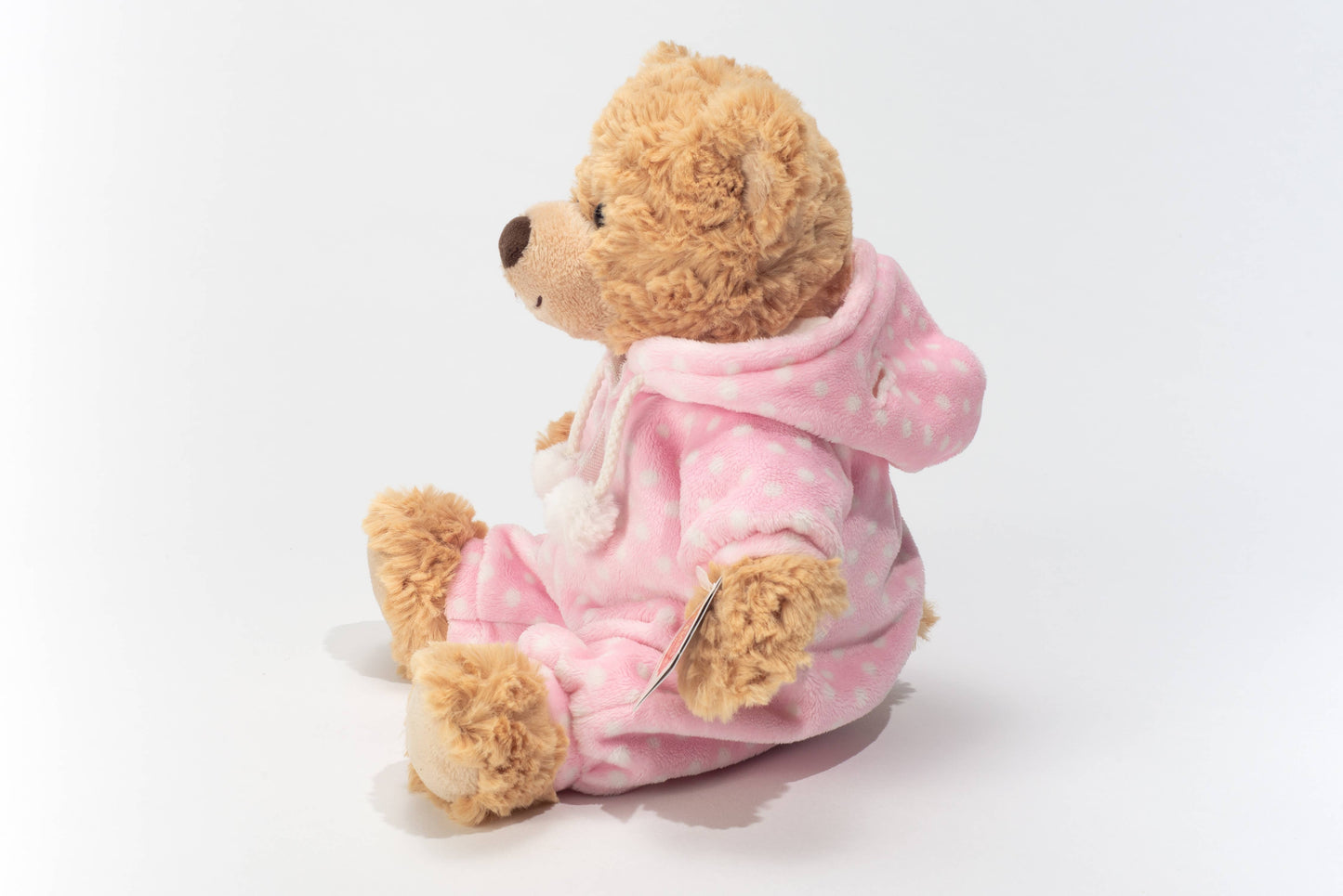 Osito de peluche en pijama rosa