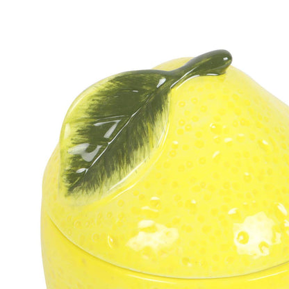 Lemon-colored oil burner with lid