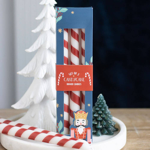 Conjunto de 3 velas cónicas de Natal às riscas em formato de bengala doce.