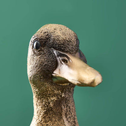 Tarjetero de resina con forma de pato dorado