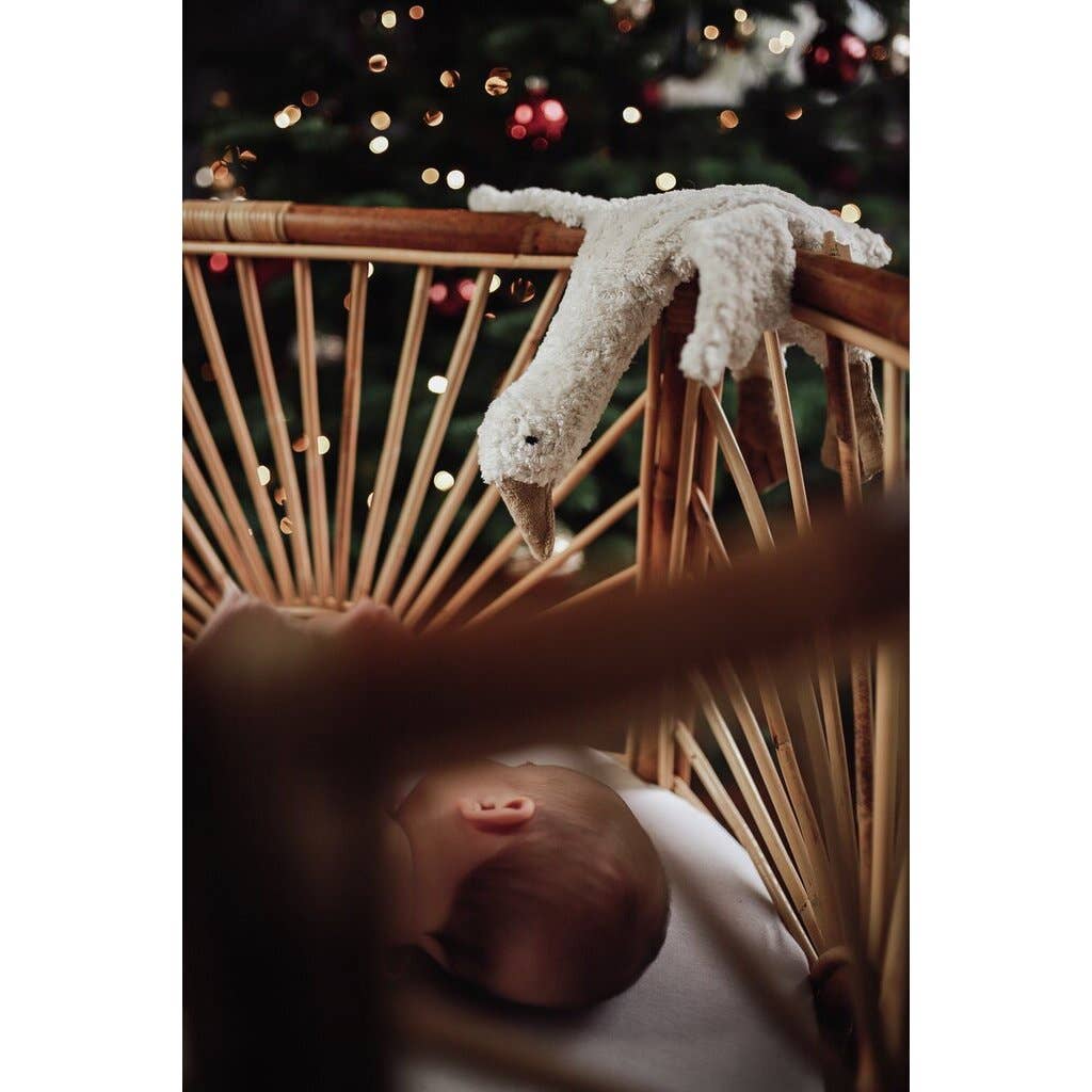 Small hot water bottle in the shape of a cuddly white goose