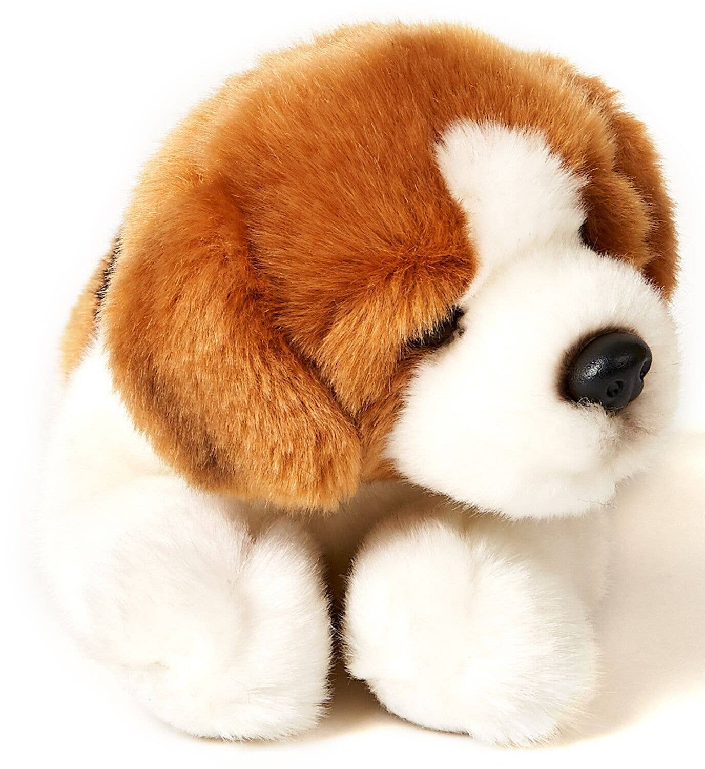 Cachorro beagle de peluche, acostado