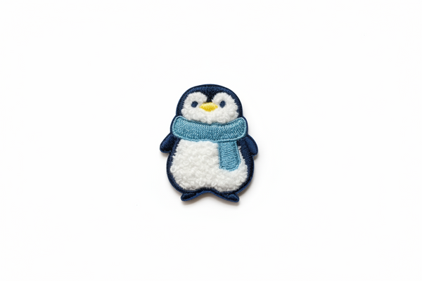 Toppa termoadesiva a forma di pinguino
