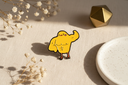 Pin de pato amarillo musculoso