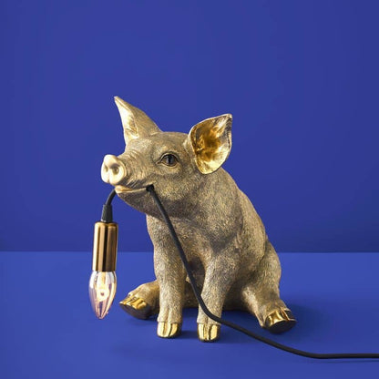 Lampada da tavolo a forma di maiale dorato