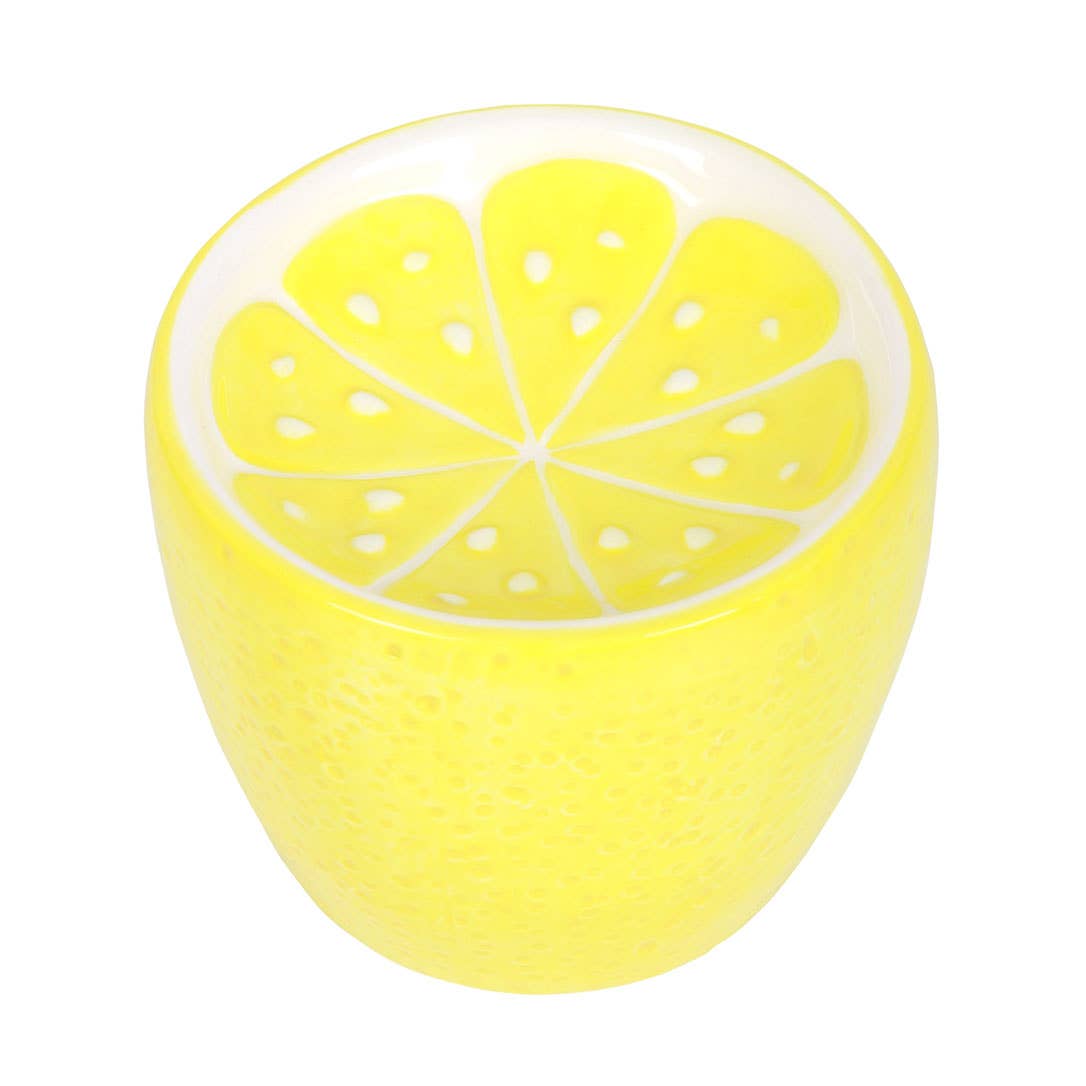 Lemon-colored oil burner with lid