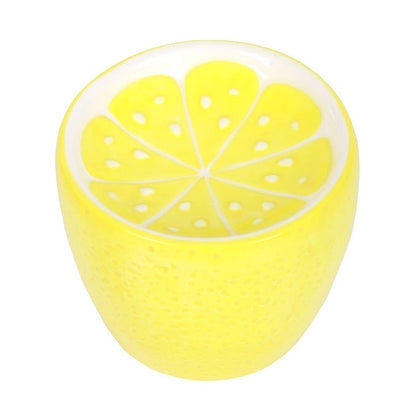 Lemon-colored oil burner with lid