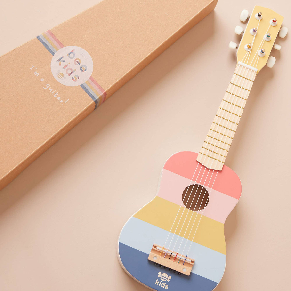 Guitarra de juguete de madera a rayas para niños