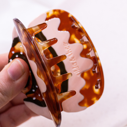 Pinza para el pelo sueca con forma de rollo de canela