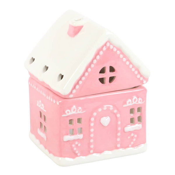 Quemador de aceite navideño con forma de casa de jengibre rosa