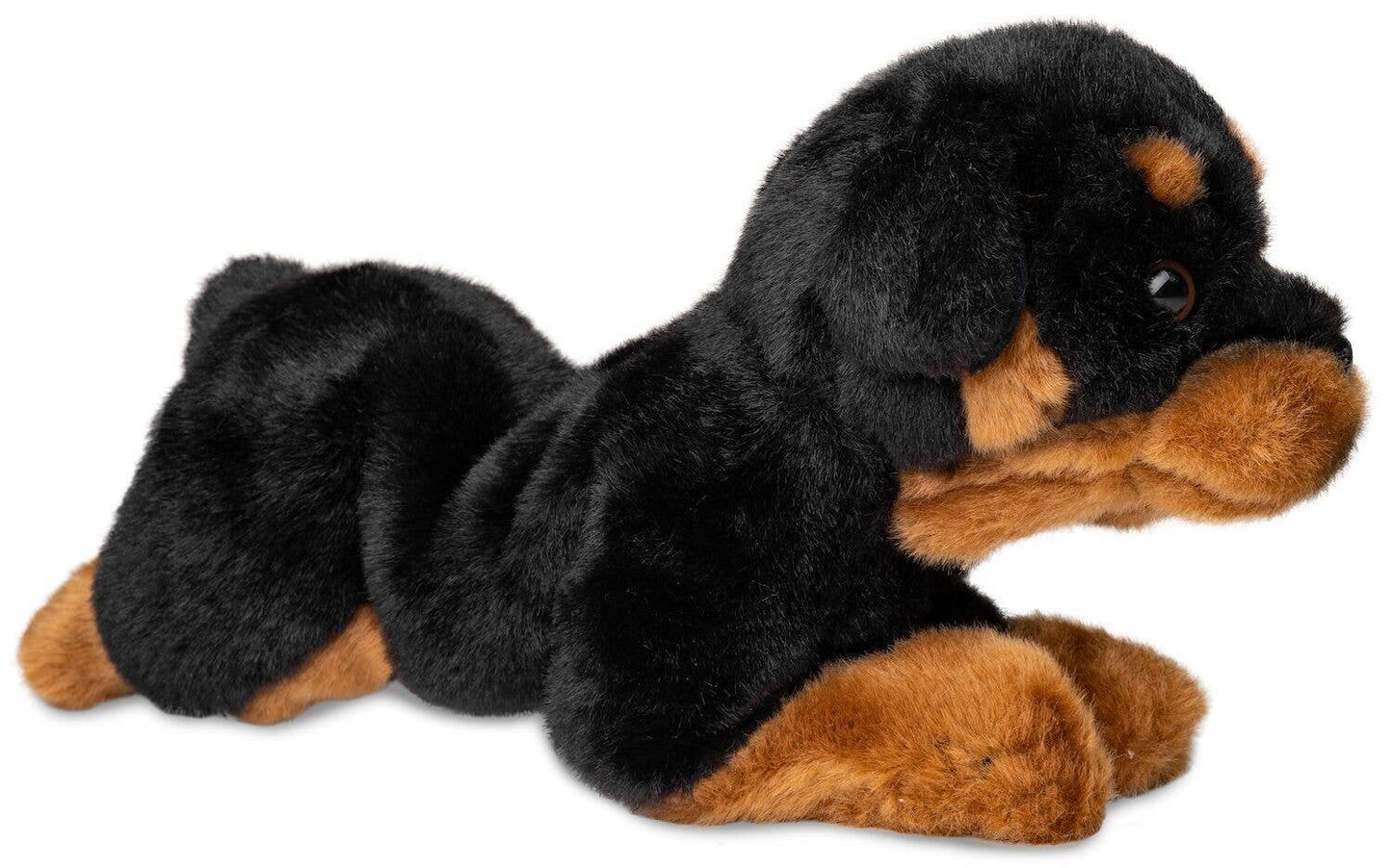 Rottweiler de peluche acostado