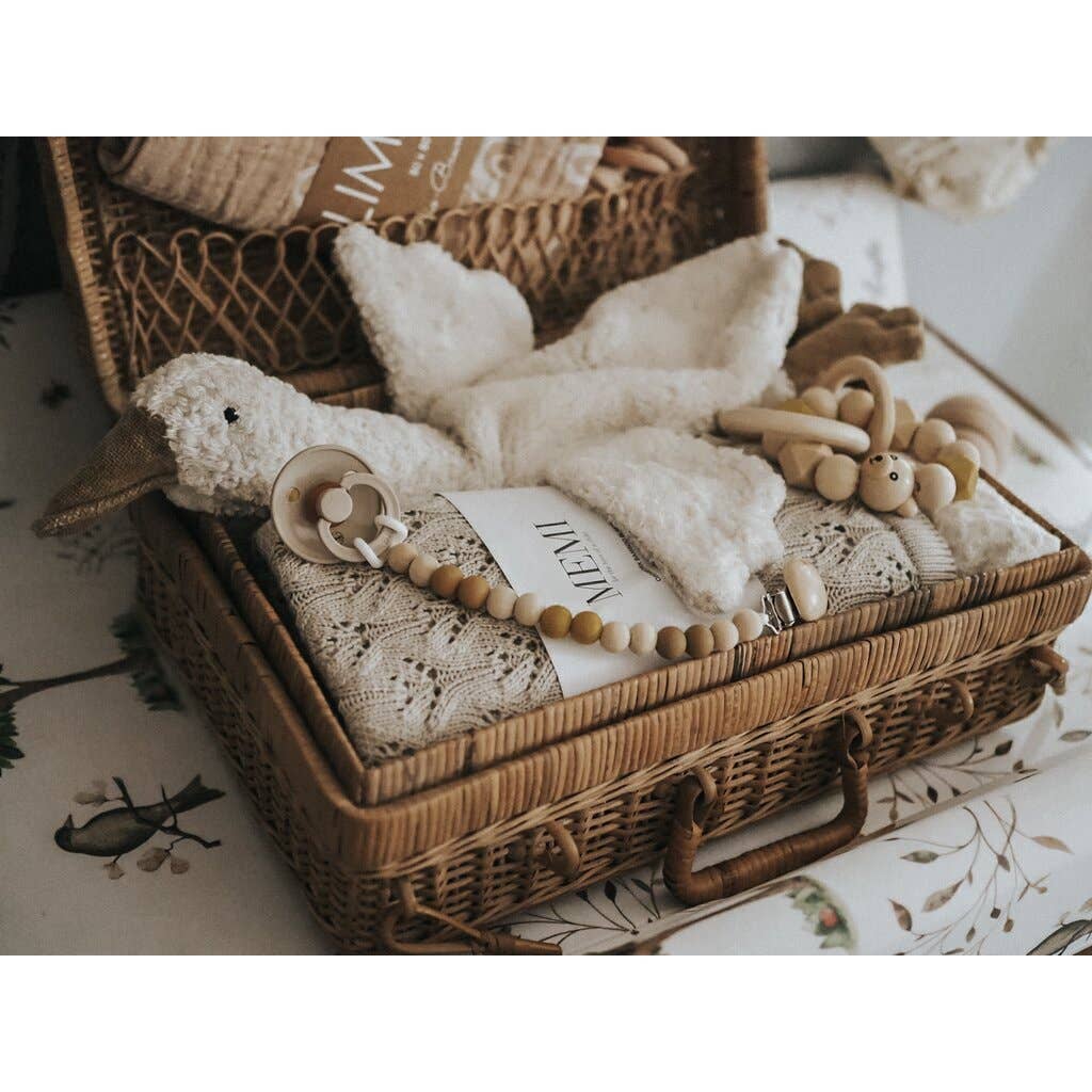 Small hot water bottle in the shape of a cuddly white goose