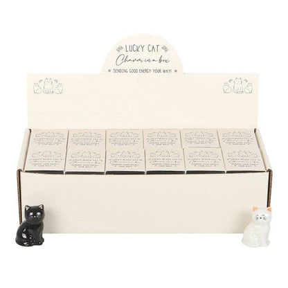 Porte-bonheur chats blancs et noirs