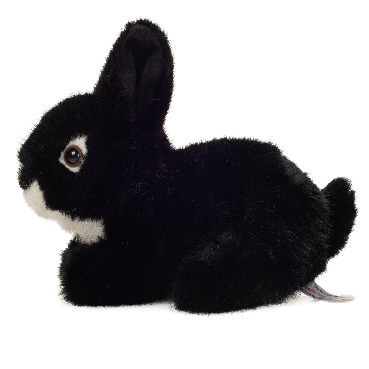 Sitzendes schwarzes Kaninchen-Plüschtier