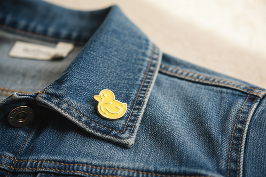 Alfileres de pato de baño amarillo